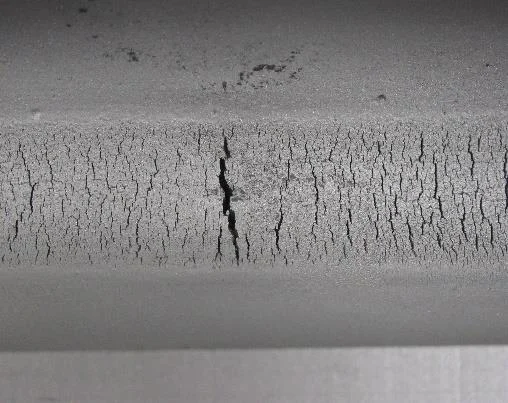 Cracking in a metal surface under magnification